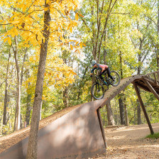 Mountain biking down a bridge in Coler Preserve, Arkansas