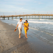 A couple walks along the shore in Myrtle Beach, South Carolina