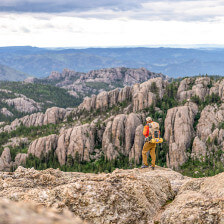 Standing atop a rocky peak in South Dakota's Custer State Park