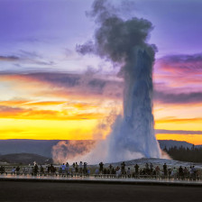 Admiring the "Old Faithful" geyser in Yellowstone National Park, Wyoming